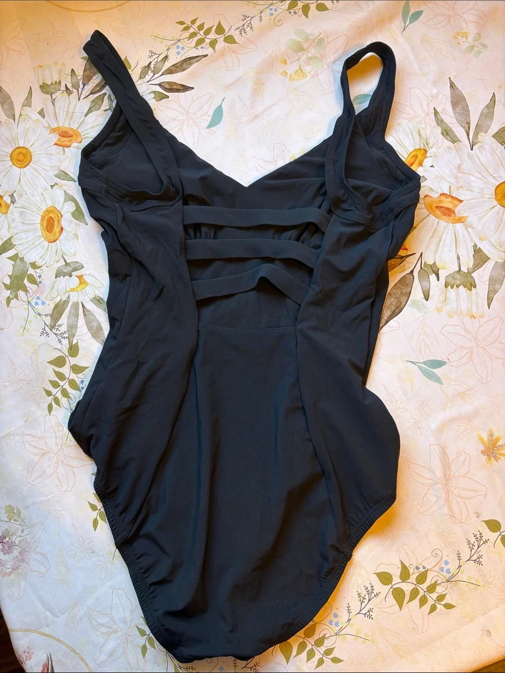Sleek Black One-Piece Swimsuit with Gold Button Accents